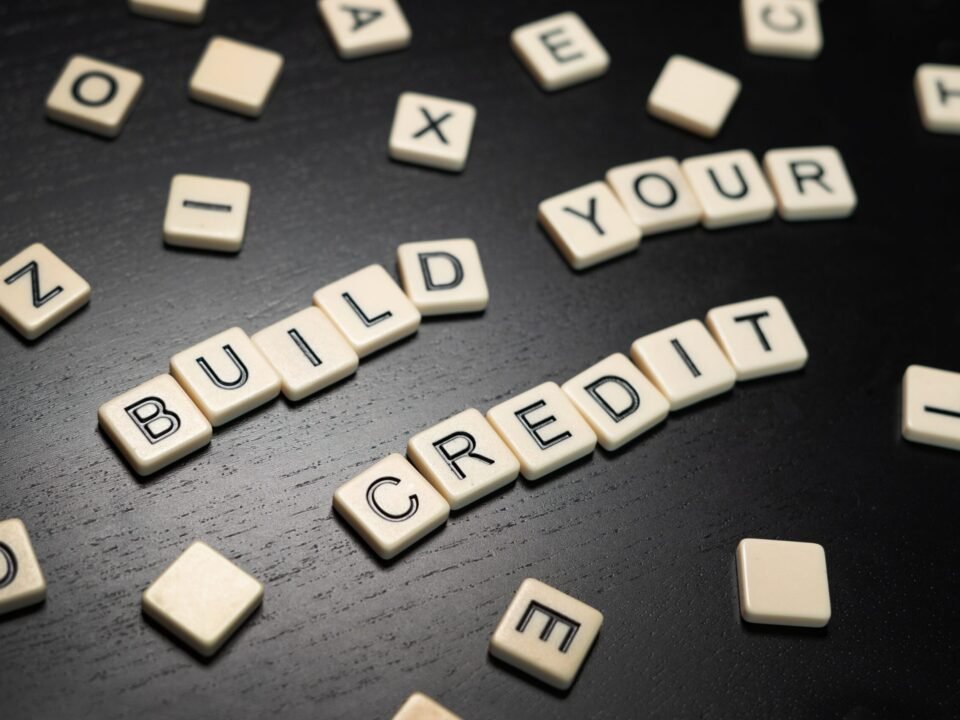 Tile letters spelling out “Build Your Credit”