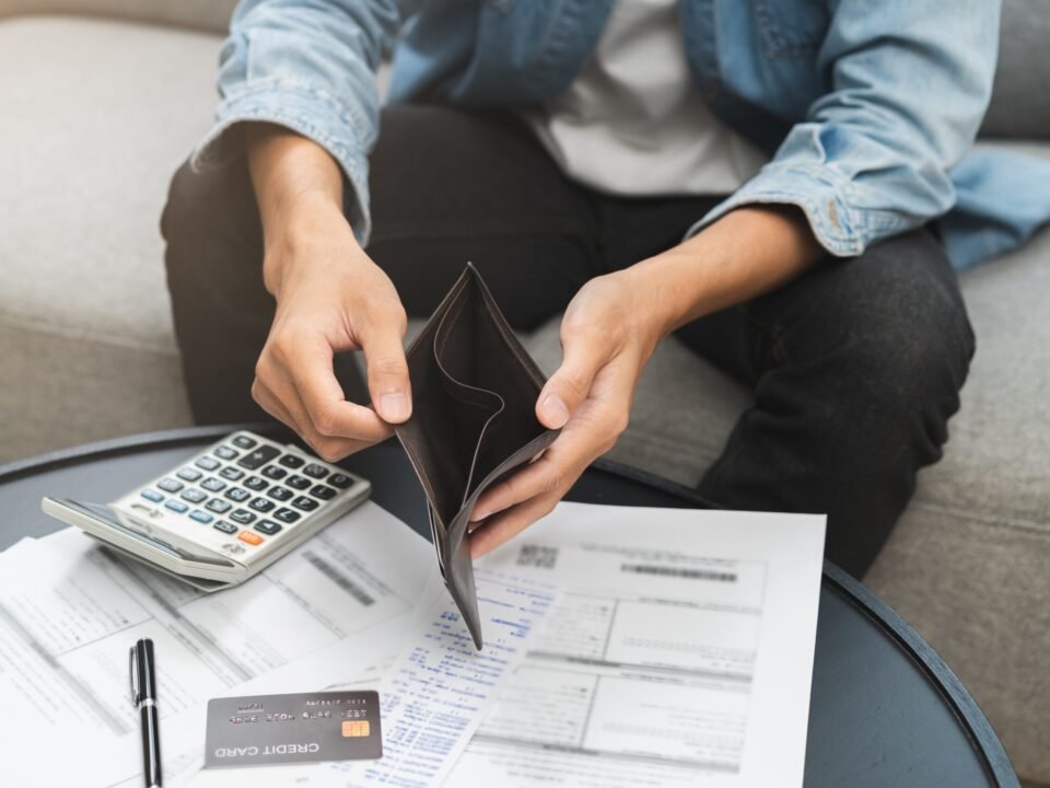 Person holding an empty wallet
